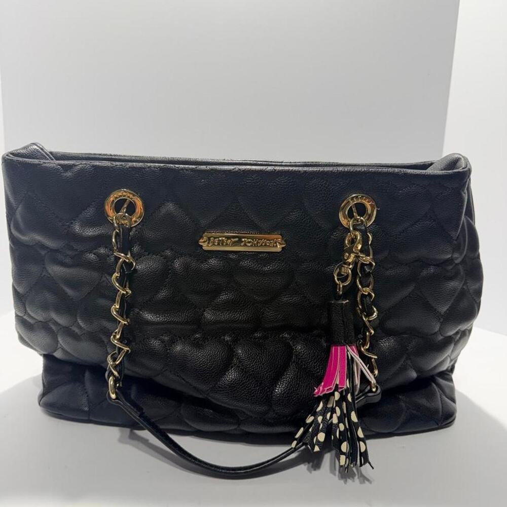Betsey Johnson black quilted heart-shaped handbag with gold hardware and tassels
